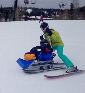 a Dream volunteer with a participant in a sit ski