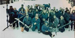 historic photo of a group of skiers in winter