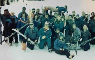 historic photo of a group of skiers in winter