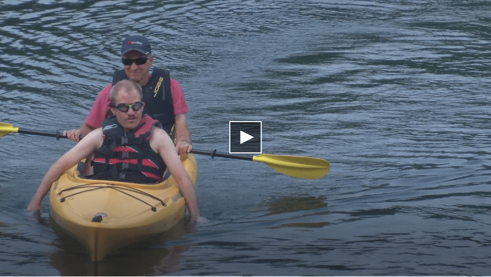 Two kayakers in a boat